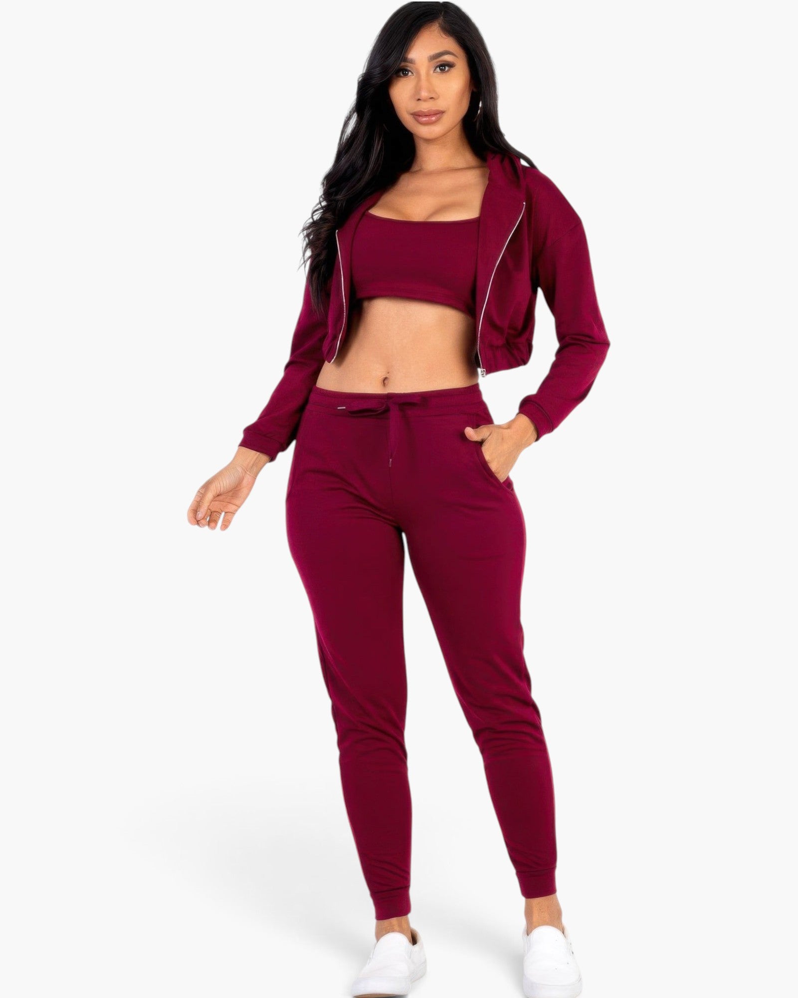 Beach Rose Co. burgundy French terry three-piece set with cropped cami, zip-up jacket, and joggers on a model.
