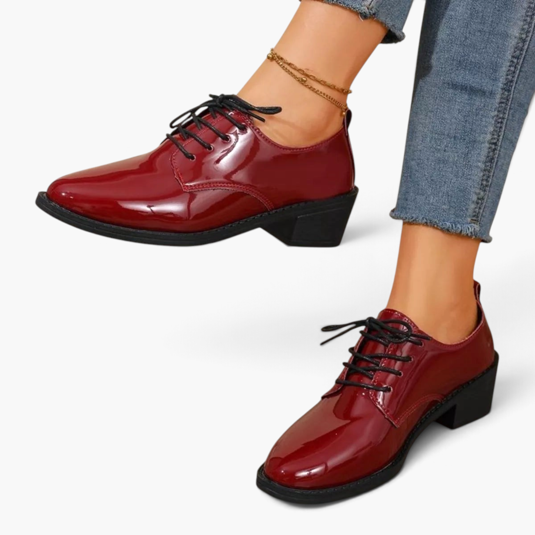 Beach Rose Co. burgundy patent lace-up oxford shoes with a low block heel and stitched panel detailing on a model.