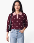 Model wearing Beach Rose Co. burgundy knit sweater with blush polka dots, contrast scalloped collar, and pearl buttons.