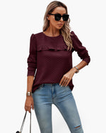 Beach Rose Co. burgundy quilted crewneck pullover with ruffle detail worn by a woman with sunglasses and jeans