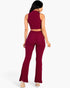 Beach Rose Co. burgundy ribbed mock neck crop tank top and bootcut pants set worn by a model, back view