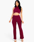 Beach Rose Co. burgundy ribbed mock neck crop tank top and matching bootcut pants set worn by a model.