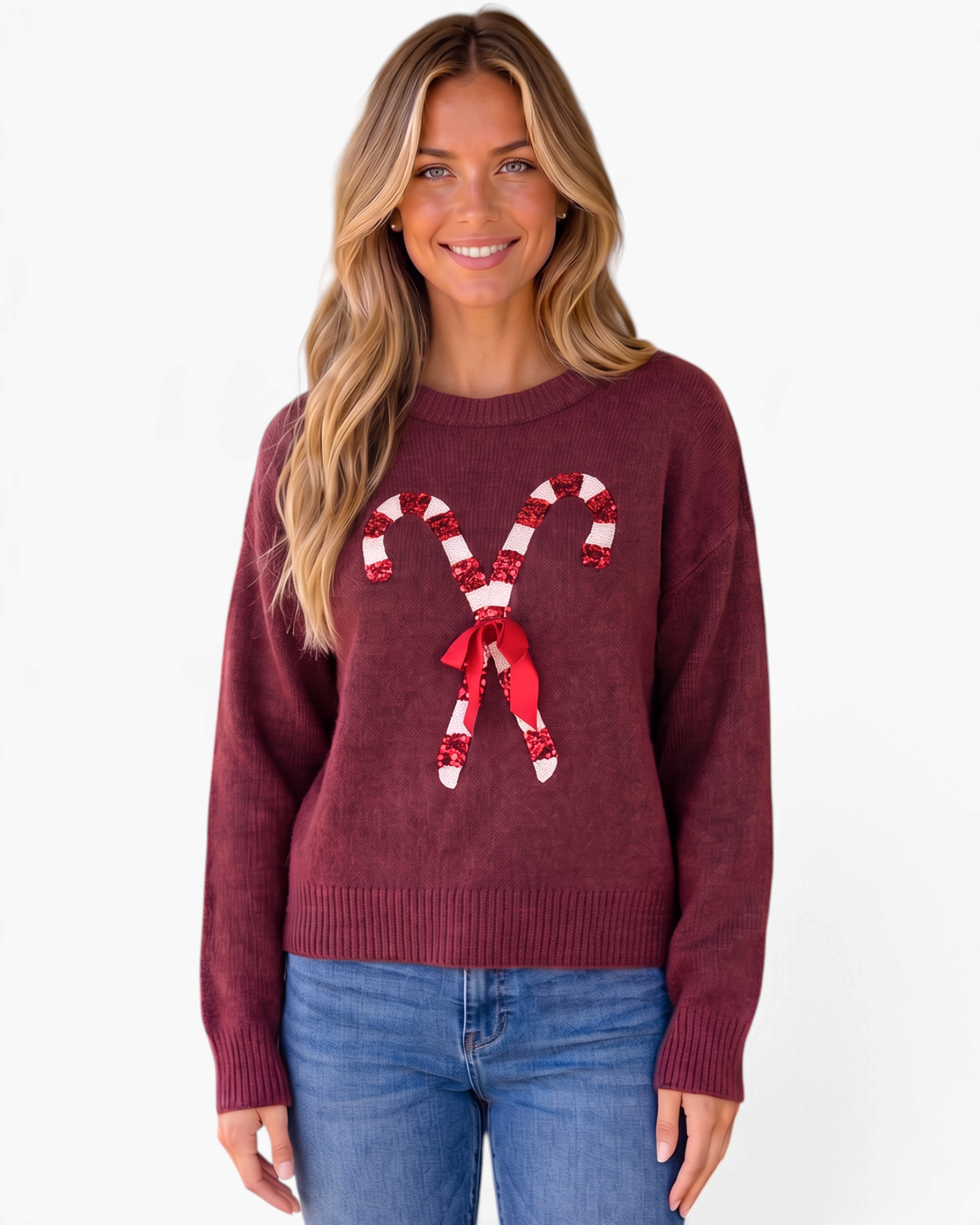 Beach Rose Co. burgundy crewneck sweater with sequin candy cane and ribbon bow design worn by a smiling blonde woman