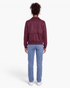 Back view of a Beach Rose Co. burgundy faux suede zip-up jacket with a collar and ribbed hem.
