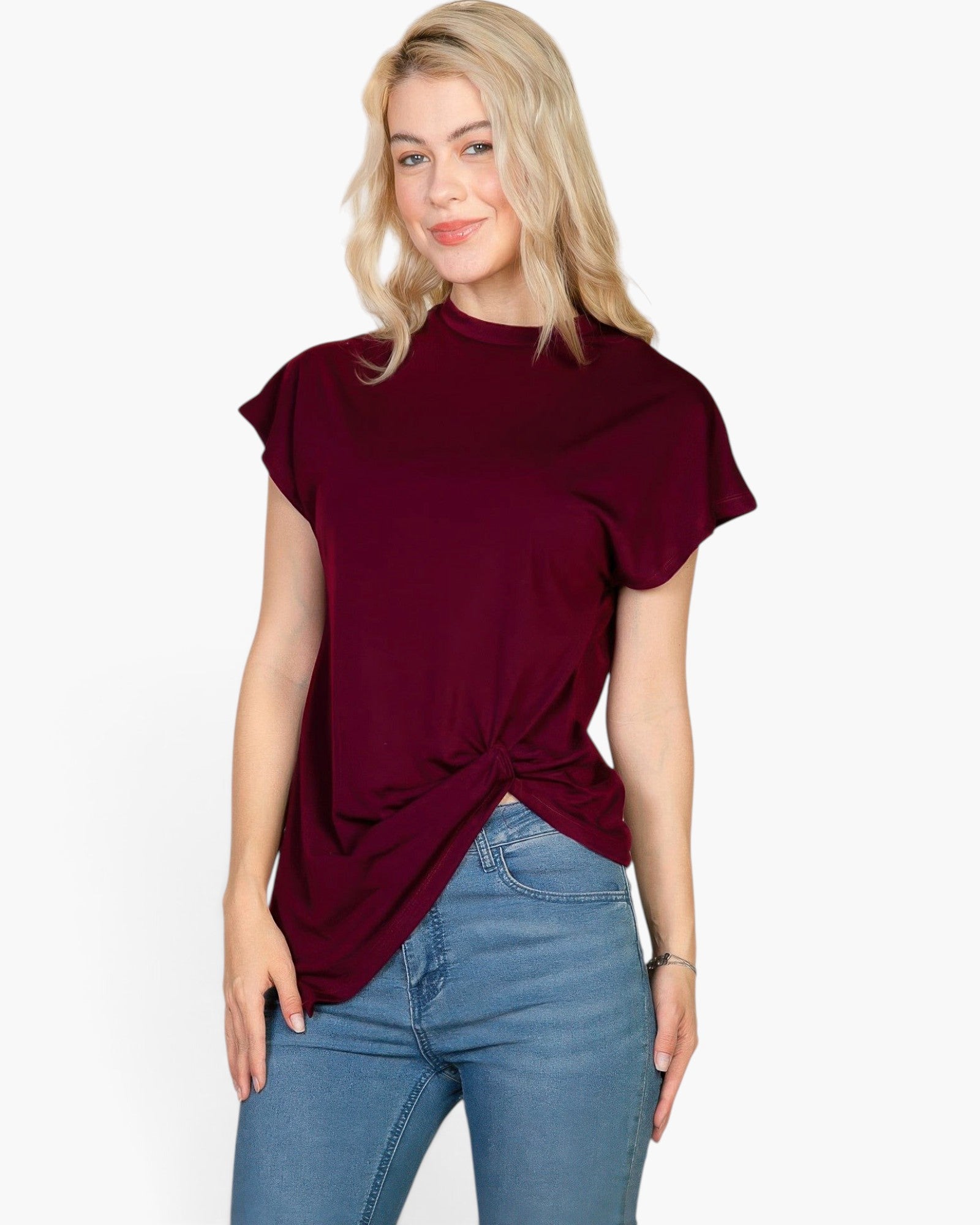 Beach Rose Co. burgundy batwing sleeve tee with a twist front detail worn by a blonde model with blue jeans