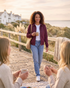 Beach Rose Co. burgundy zip-up jacket with a metal placket collar worn by a woman outdoors.