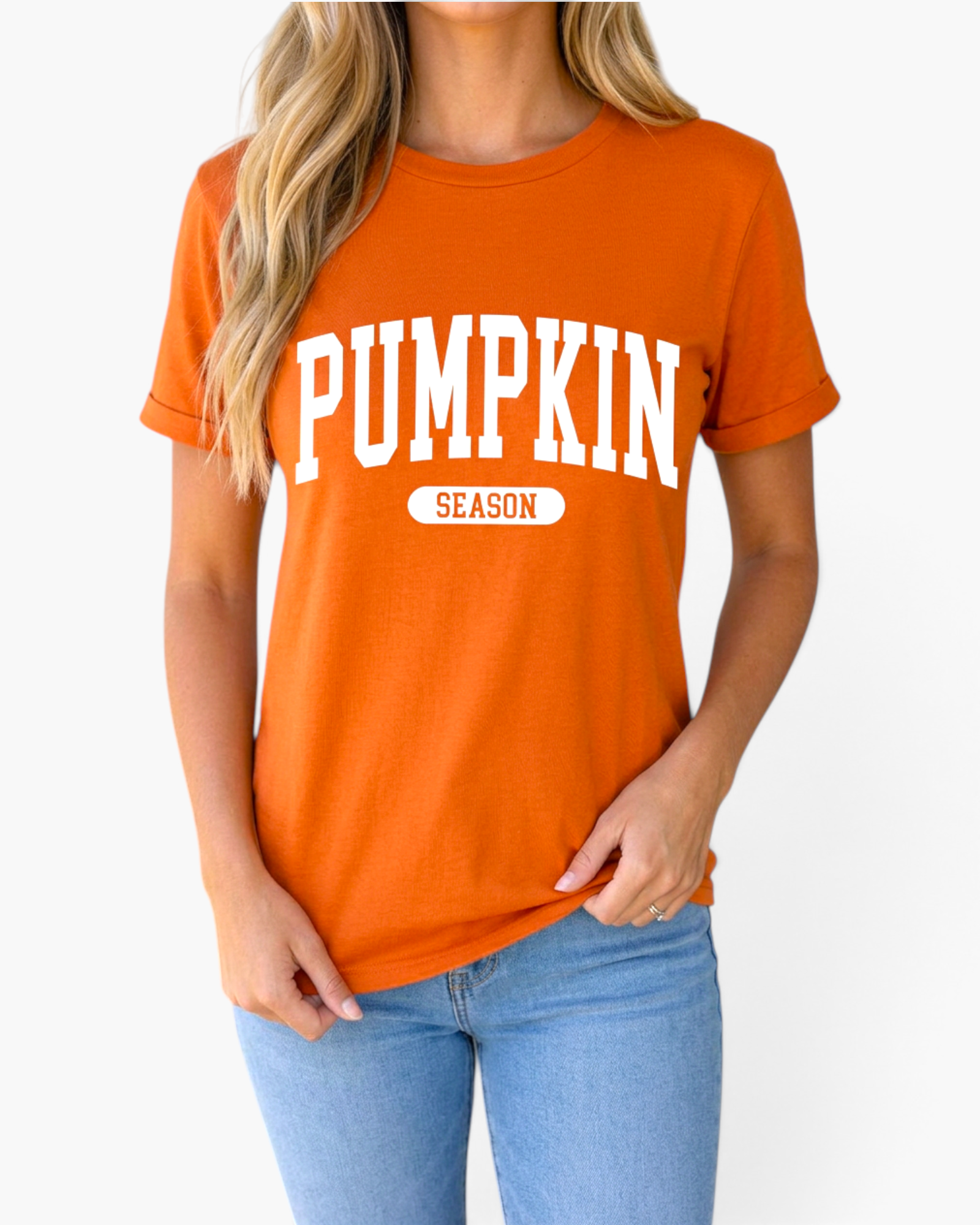 Beach Rose Co. burnt orange short-sleeve tee with white collegiate-style Pumpkin Season graphic on a woman