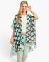 Beach Rose Co. lightweight kimono with butterfly wing print in teal and black, worn by a smiling model.