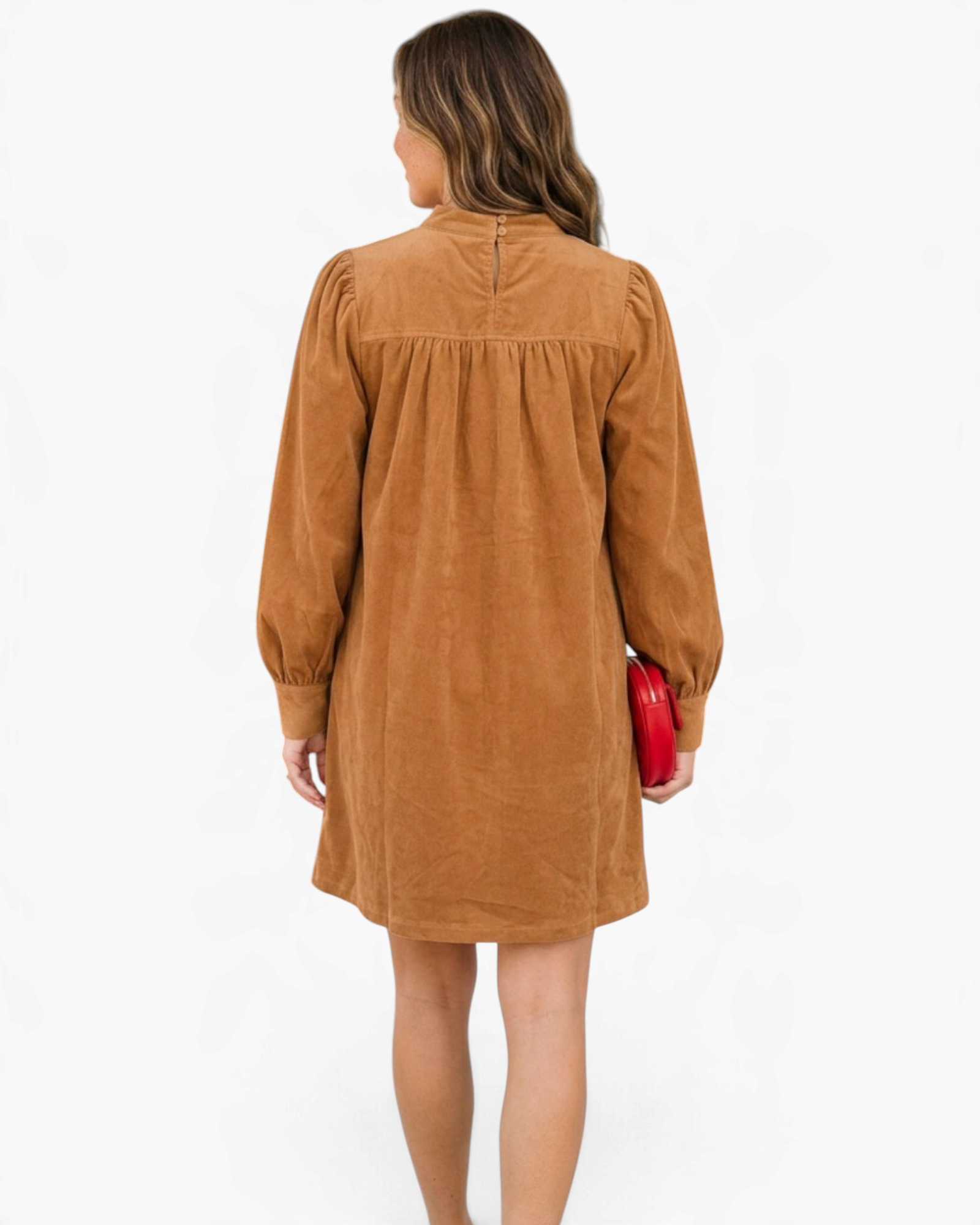 Beach Rose Co. camel corduroy mini dress with puff sleeves and gathered back yoke, back view on a model