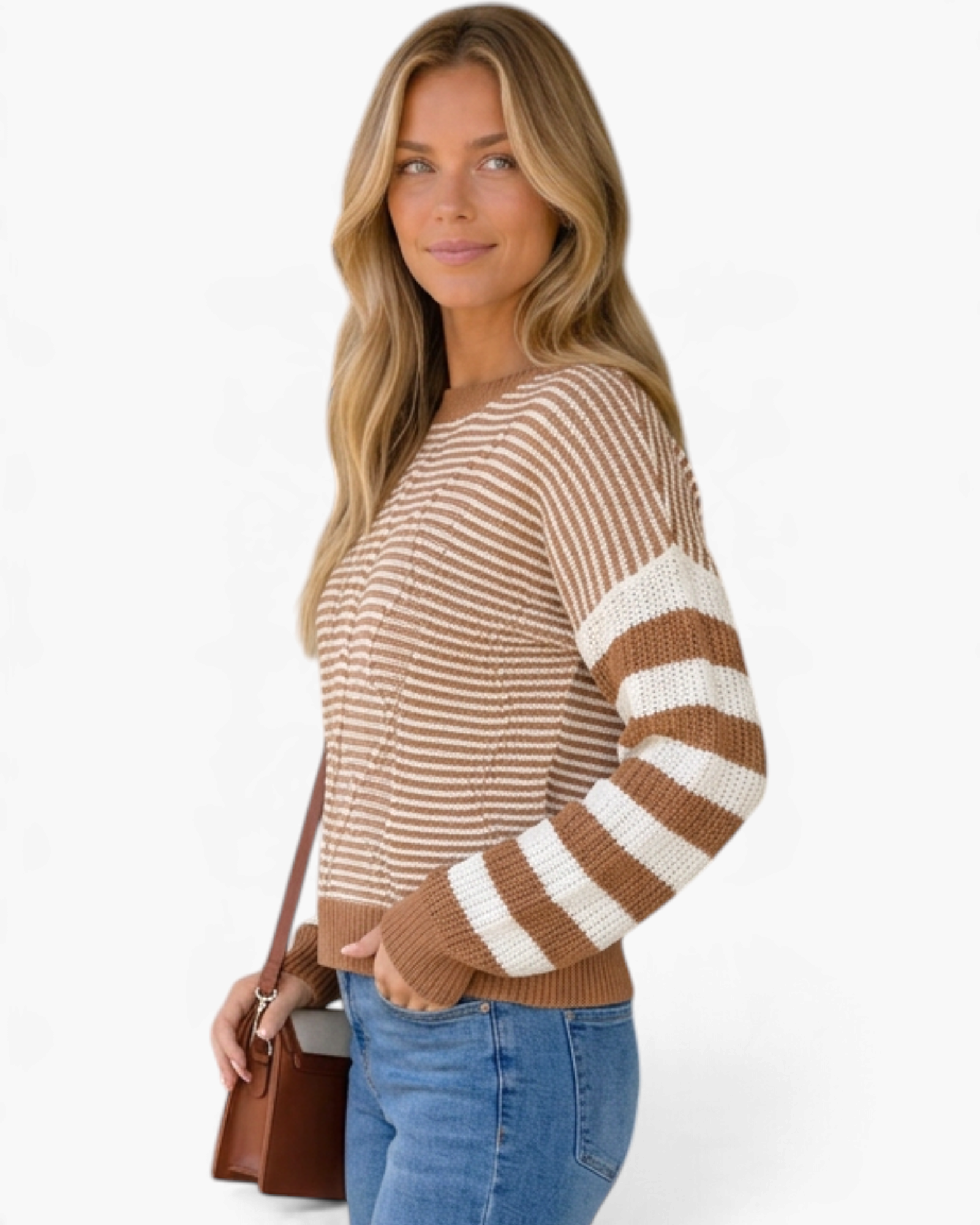 Beach Rose Co. model wearing a camel and cream mixed-stripe knit sweater with dropped shoulders and ribbed trim.