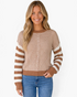 Beach Rose Co. model wearing a camel and cream mixed-stripe knit sweater with dropped shoulders and ribbed trim.