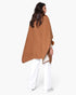 Beach Rose Co. camel faux fur collar kimono worn over white trousers, showing a relaxed, flowing back silhouette.