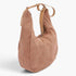 Beach Rose Co. camel faux suede bindle bag with a structured silhouette and a sturdy leather shoulder strap.