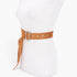 Beach Rose Co. camel faux suede fringe belt with a silver buckle on a white mannequin torso.