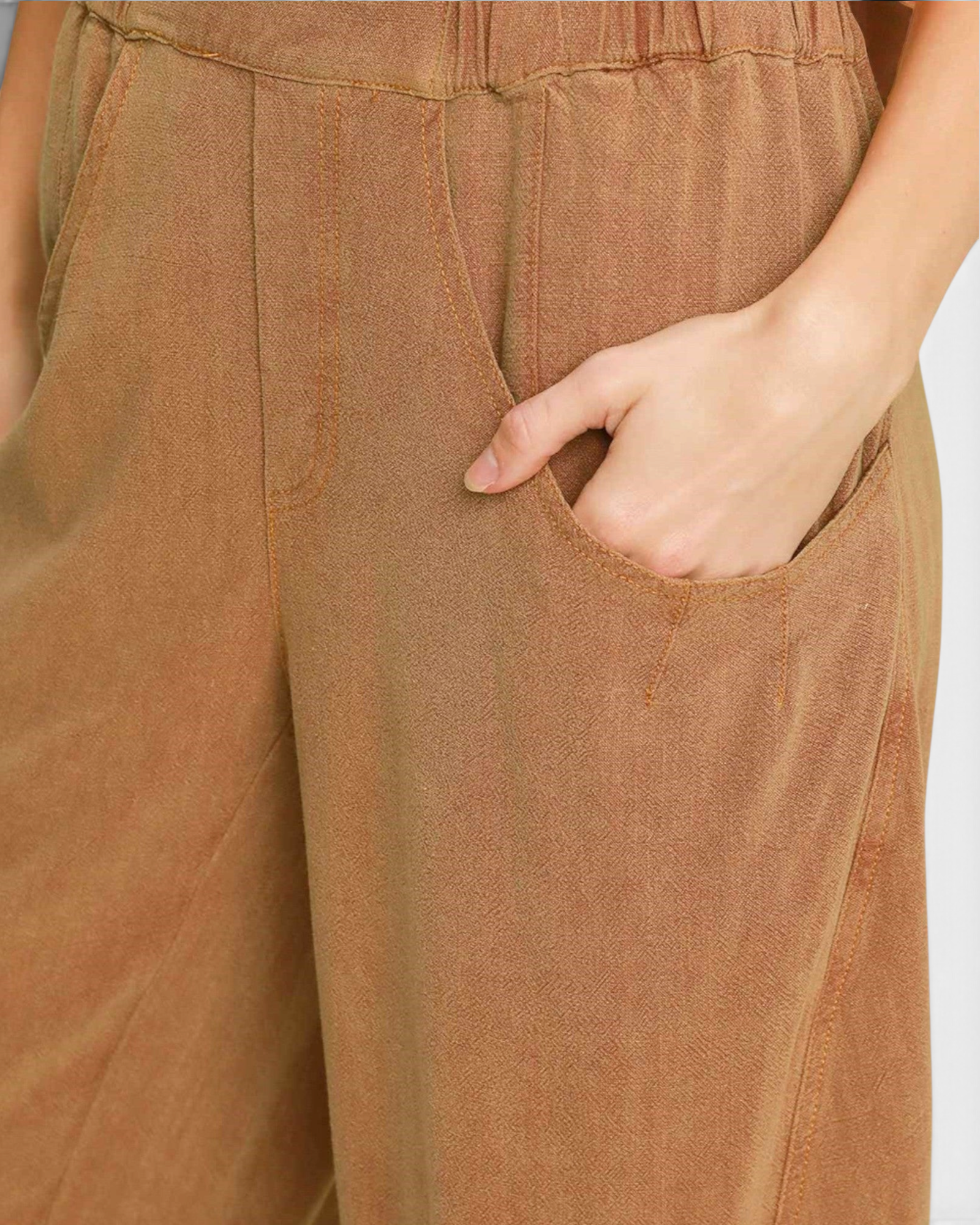 Beach Rose Co. camel linen-blend barrel-leg pants featuring oversized curved front pockets and a flat waistband.