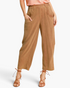 Beach Rose Co. camel linen-blend barrel-leg pants with oversized pockets and a cropped ankle-skimming length.