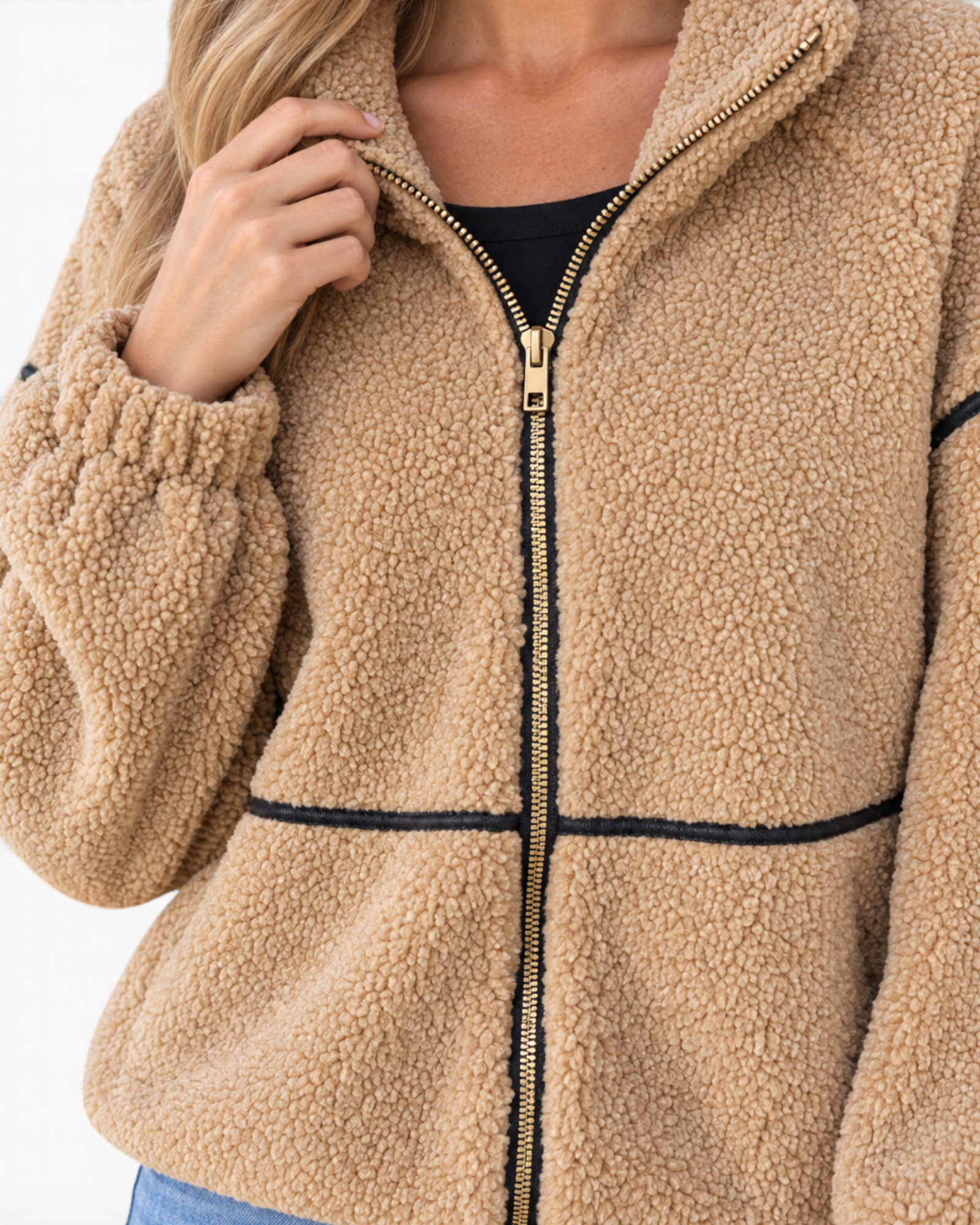 Beach Rose Co. camel sherpa jacket with black contrast trim, gold zip-front, and stand collar on a model.