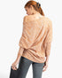 Beach Rose Co. camel knit top with tribal print, asymmetrical neckline, and dolman sleeves worn by a woman.