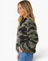 Beach Rose Co. camo print fleece sweatshirt with half-zip, black patch pocket, and relaxed fit on a smiling model.