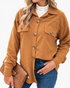 Beach Rose Co. caramel textured button-front shacket with chest pockets, worn over a white top and blue jeans.
