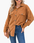 Beach Rose Co. caramel textured button-front shacket with chest pockets and a relaxed fit worn with blue jeans.
