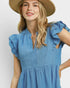 Beach Rose Co. Chambray blue mini dress with ruffle sleeves, split neckline, tiered silhouette, and side pockets.