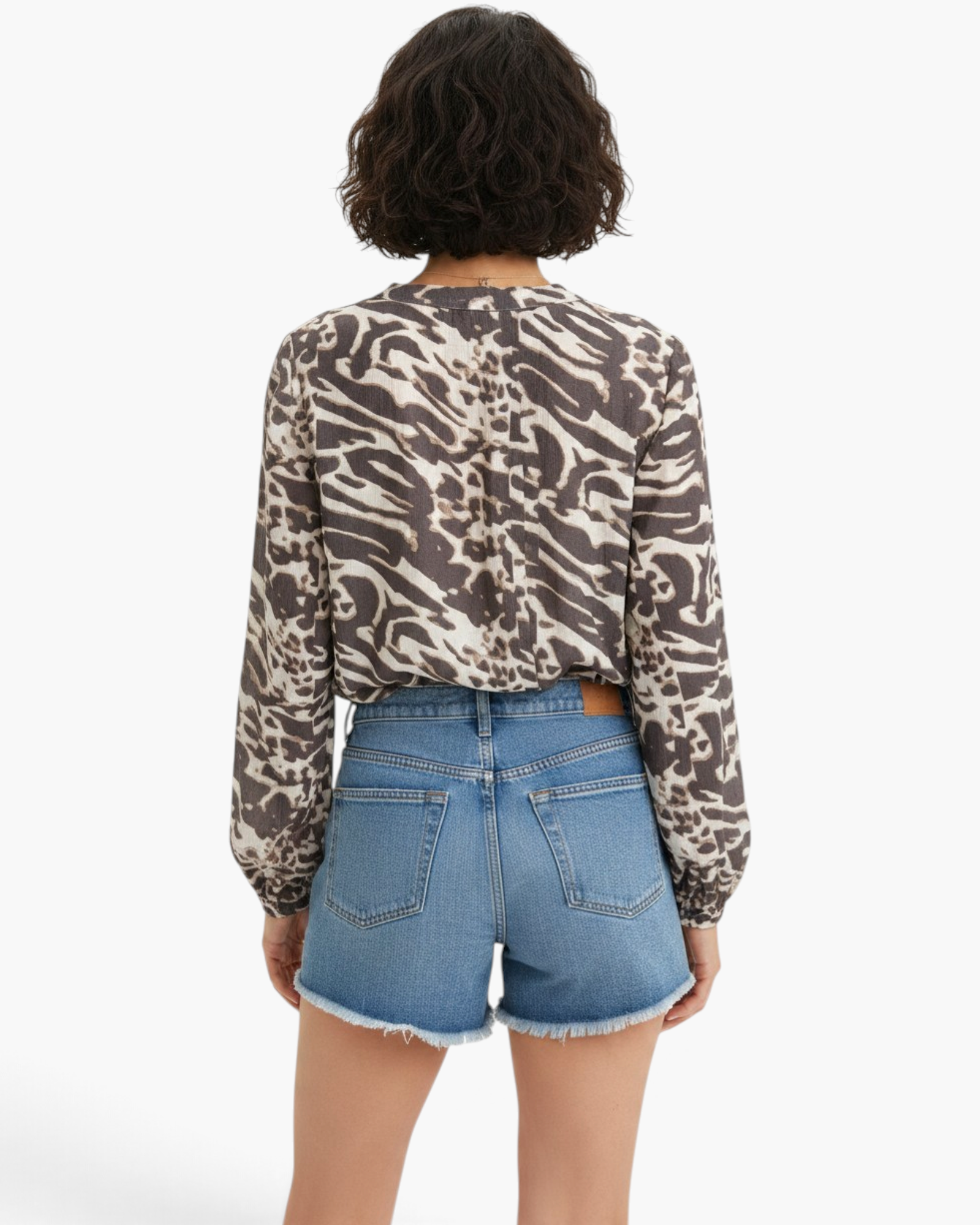Back view of Beach Rose Co. charcoal and cream viscose blend blouse with mixed animal print and long raglan sleeves.