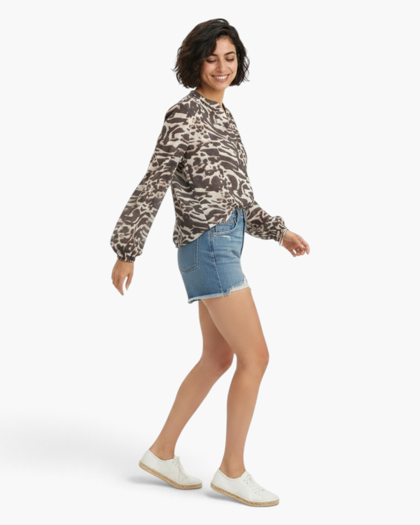 Beach Rose Co. charcoal and cream mixed animal print blouse with long raglan sleeves and a split V-neckline.