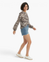 Beach Rose Co. charcoal and cream mixed animal print blouse with long raglan sleeves and a split V-neckline.