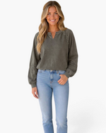 Beach Rose Co. charcoal washed sweatshirt with lace trim on shoulders and sleeves and a notched neckline on a model.