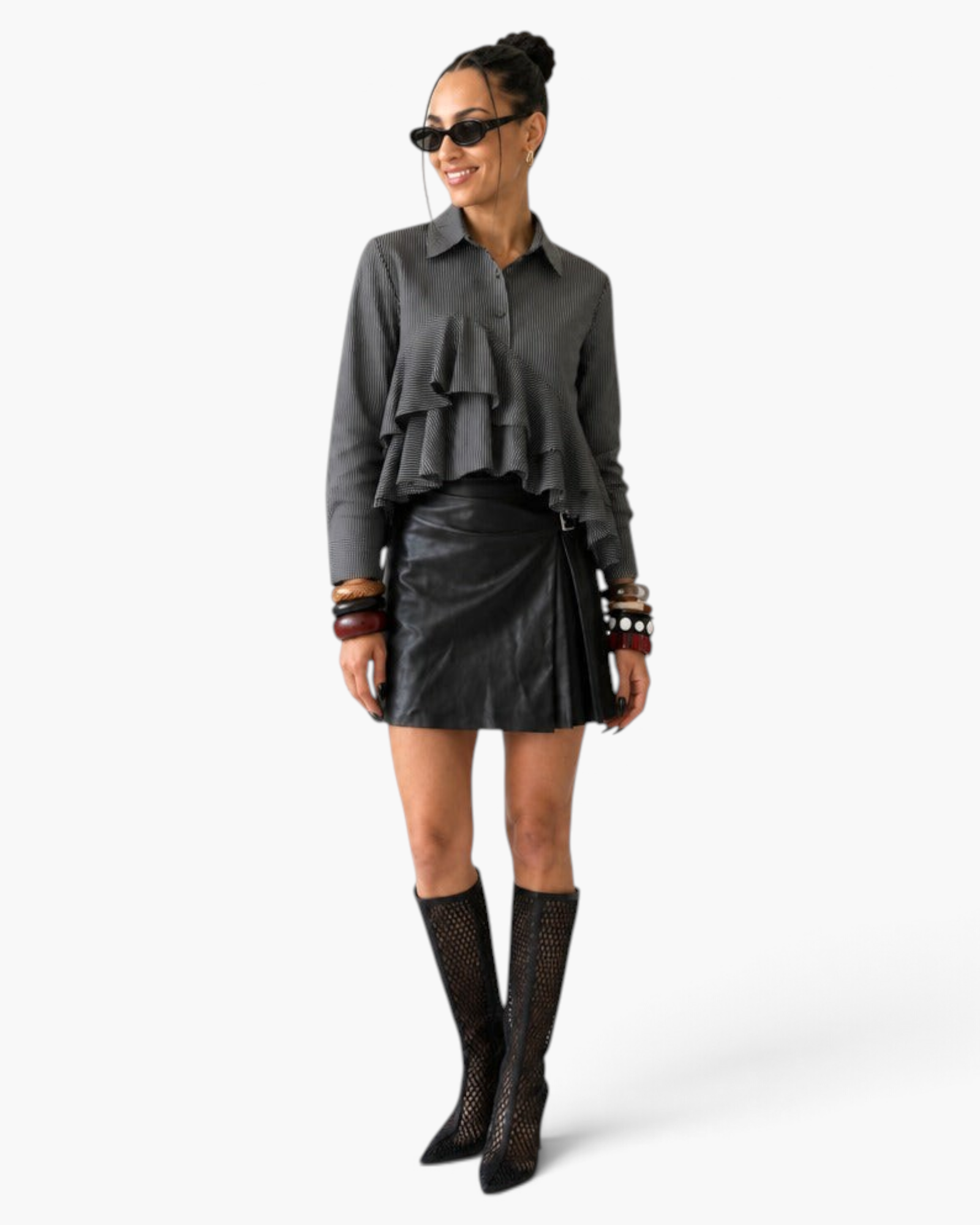 Beach Rose Co. charcoal pinstripe blouse with cascading ruffles, worn by a model with a black skirt and tall boots.