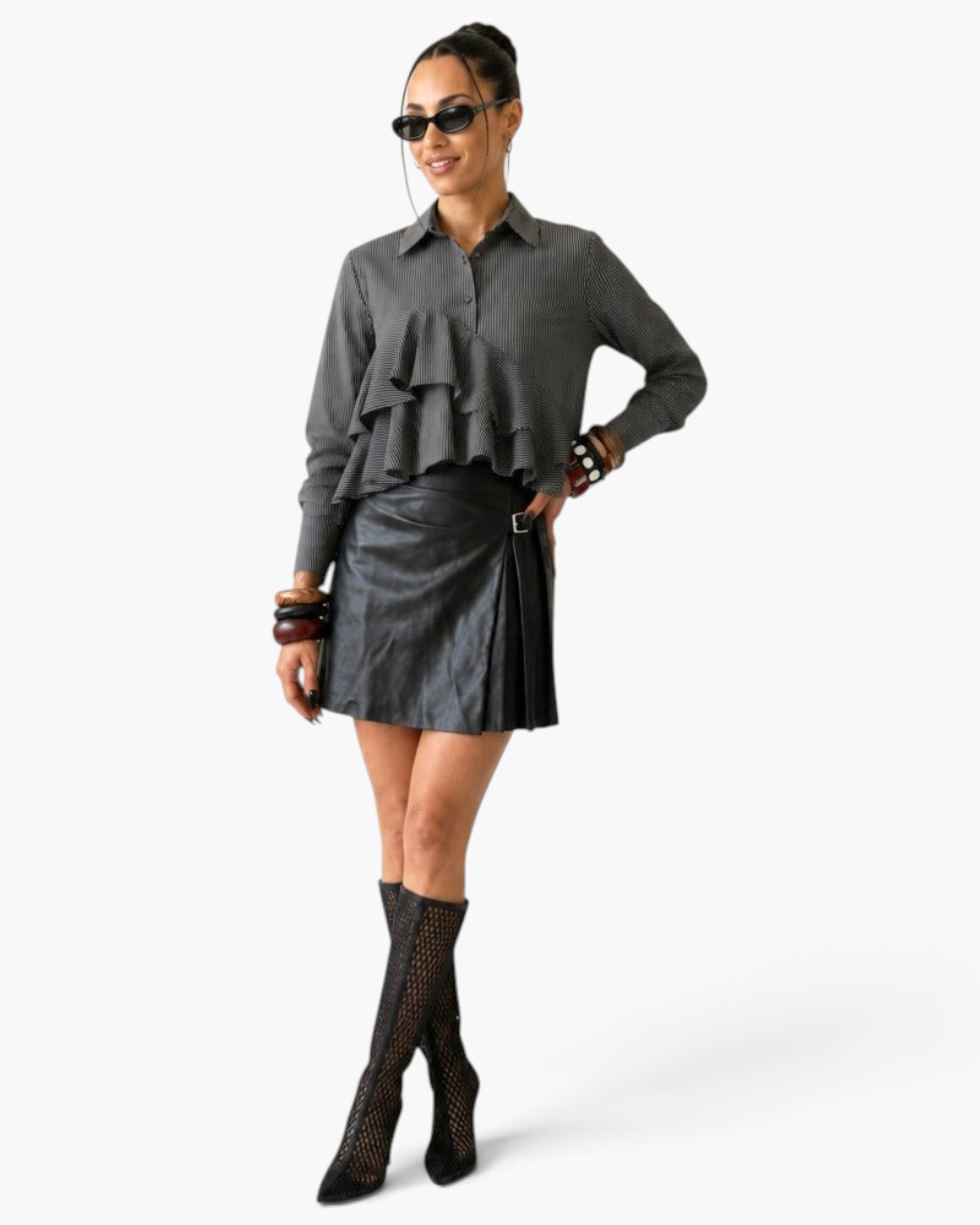 Beach Rose Co. charcoal pinstripe blouse with cascading ruffles, worn by a model with a black leather skirt.