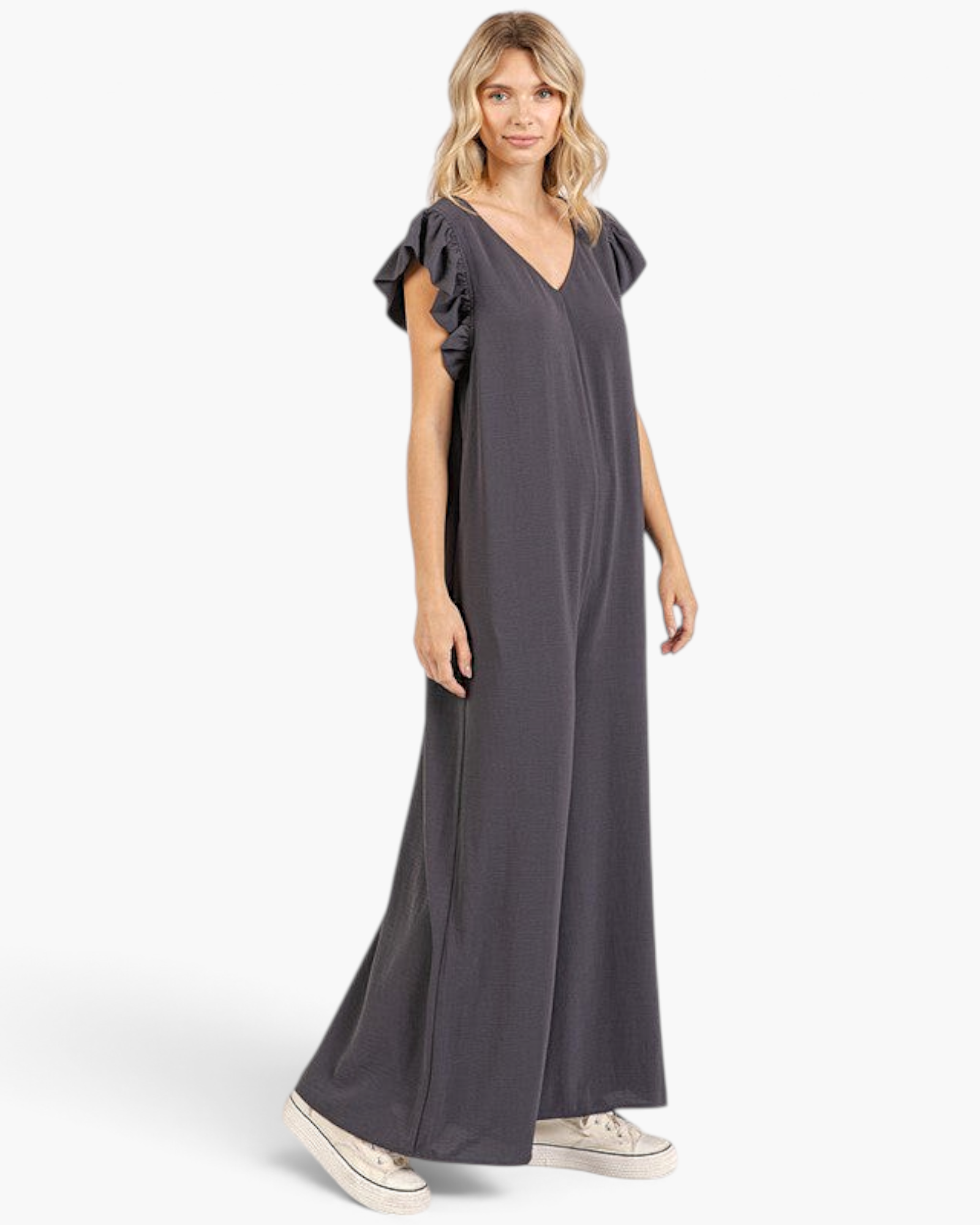 Beach Rose Co. charcoal wide-leg jumpsuit with layered ruffle sleeves and a V-neckline worn by a blonde model.