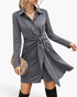 Beach Rose Co. charcoal mini shirt dress with a pointed collar, long sleeves, and a statement tie-front waist detail.