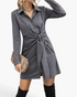 Beach Rose Co. charcoal mini shirt dress with a pointed collar, long sleeves, and a statement tie-front waist detail.