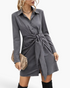 Beach Rose Co. charcoal mini shirt dress with a pointed collar, long sleeves, and a statement tie-front waist detail.