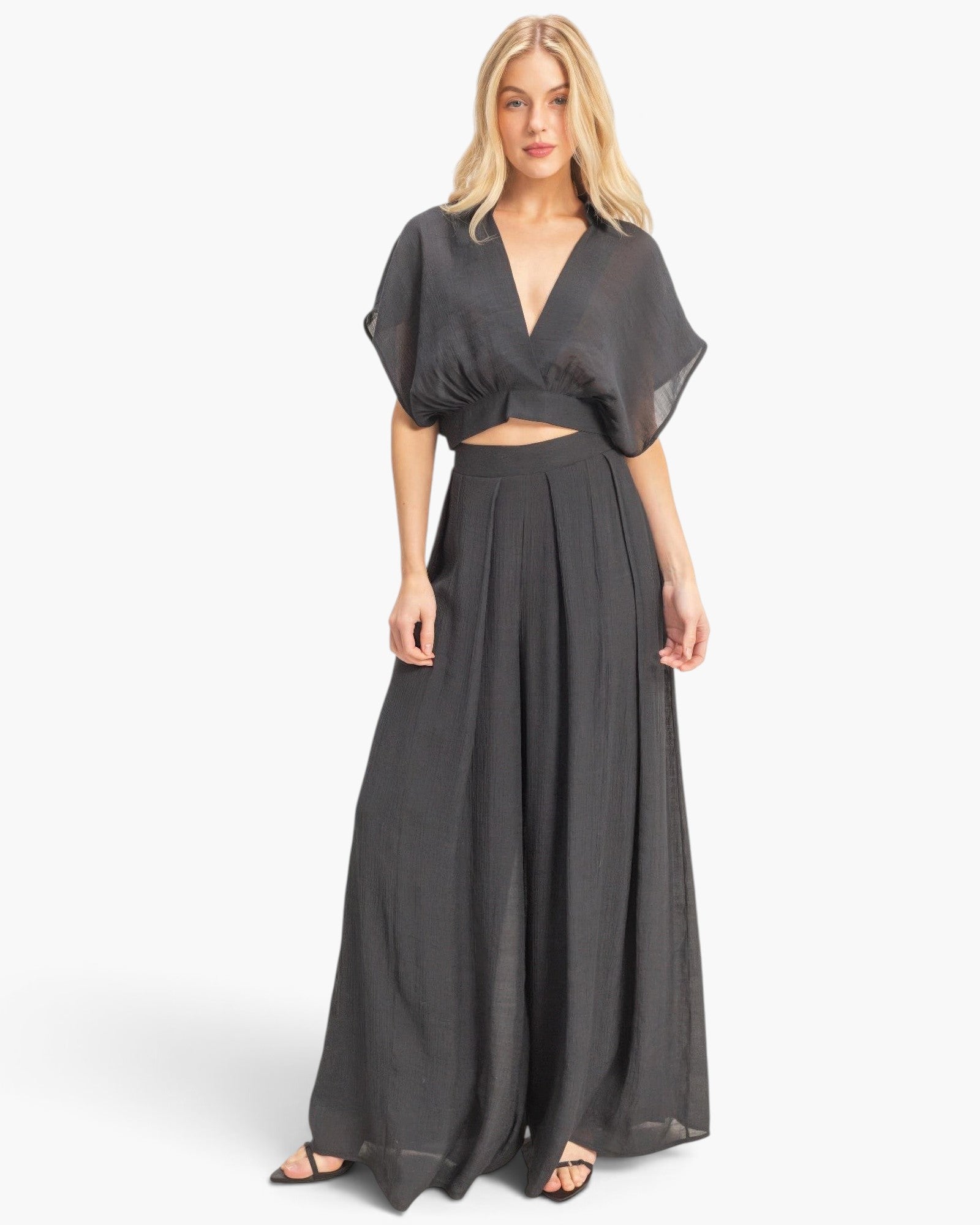 Beach Rose Co. charcoal grey two-piece set with a cropped collared wrap top and flowing pleated wide-leg pants.