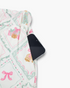 Beach Rose Co. pajama pants in cream with pastel Christmas diamond print and a functional side pocket holding a phone
