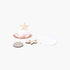 Beach Rose Co. gold and white clam shell earrings with starfish accents shown next to a coin for scale.