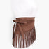 Beach Rose Co. coffee brown faux suede wrap belt featuring long fringe detailing and a side tie closure on a mannequin