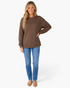 Beach Rose Co. coffee brown crew neck sweatshirt with geometric texture, worn by a smiling blonde model with jeans.
