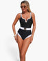 Beach Rose Co. black and white color block one-piece swimsuit with a metal buckle belt and scoop neckline.