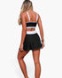 Beach Rose Co. two-piece color block bikini with a black and white high-waisted skirted bottom and matching top.