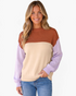 Beach Rose Co. color block sweater in rust, cream, and lavender with ribbed crew neck and relaxed fit on a model.