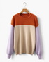 Beach Rose Co. color block sweater in rust, cream, and lavender with ribbed crew neck and dropped shoulders.