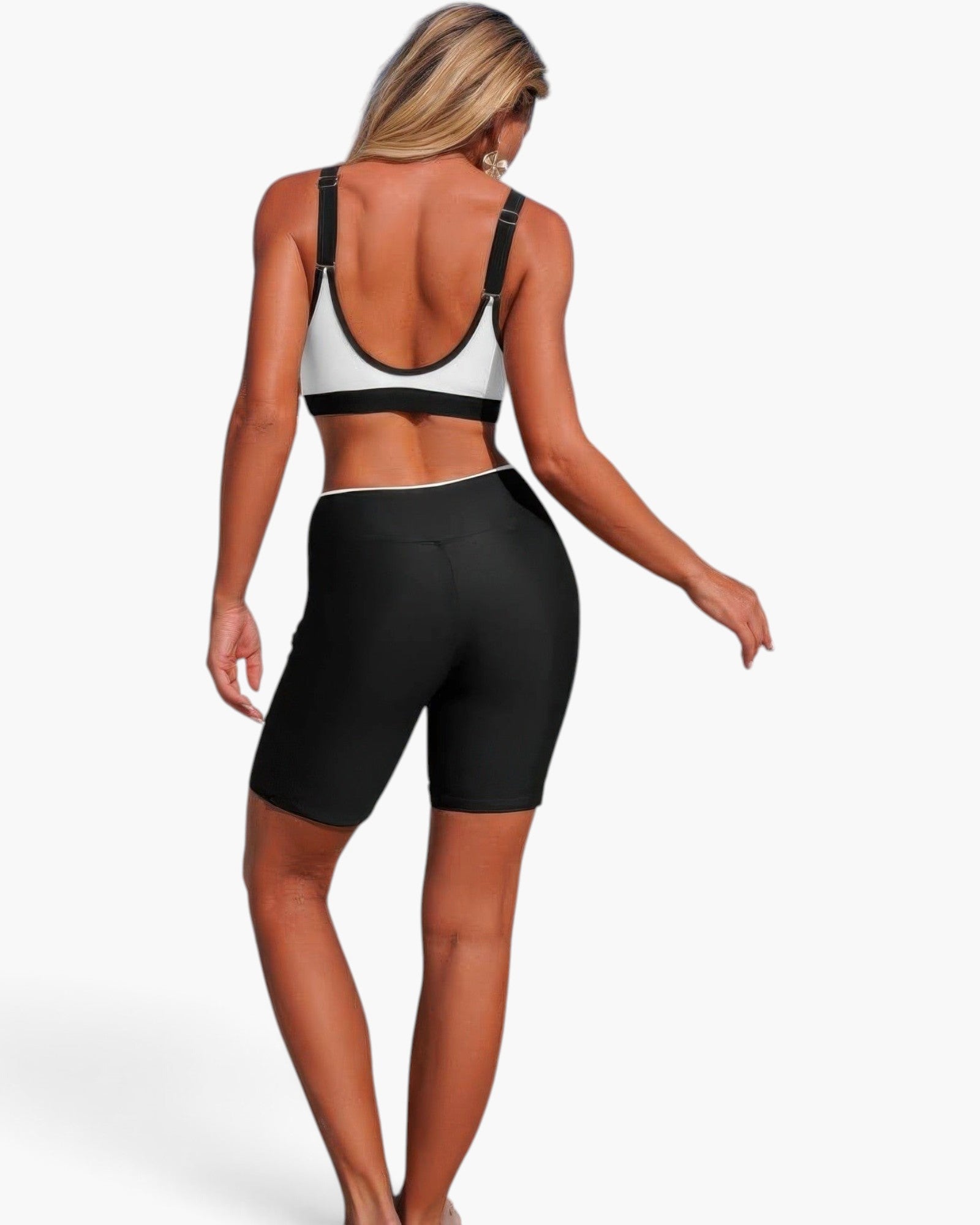 Beach Rose Co. two-piece yoga set with a black and white color block sports bra and matching high-waisted biker shorts.