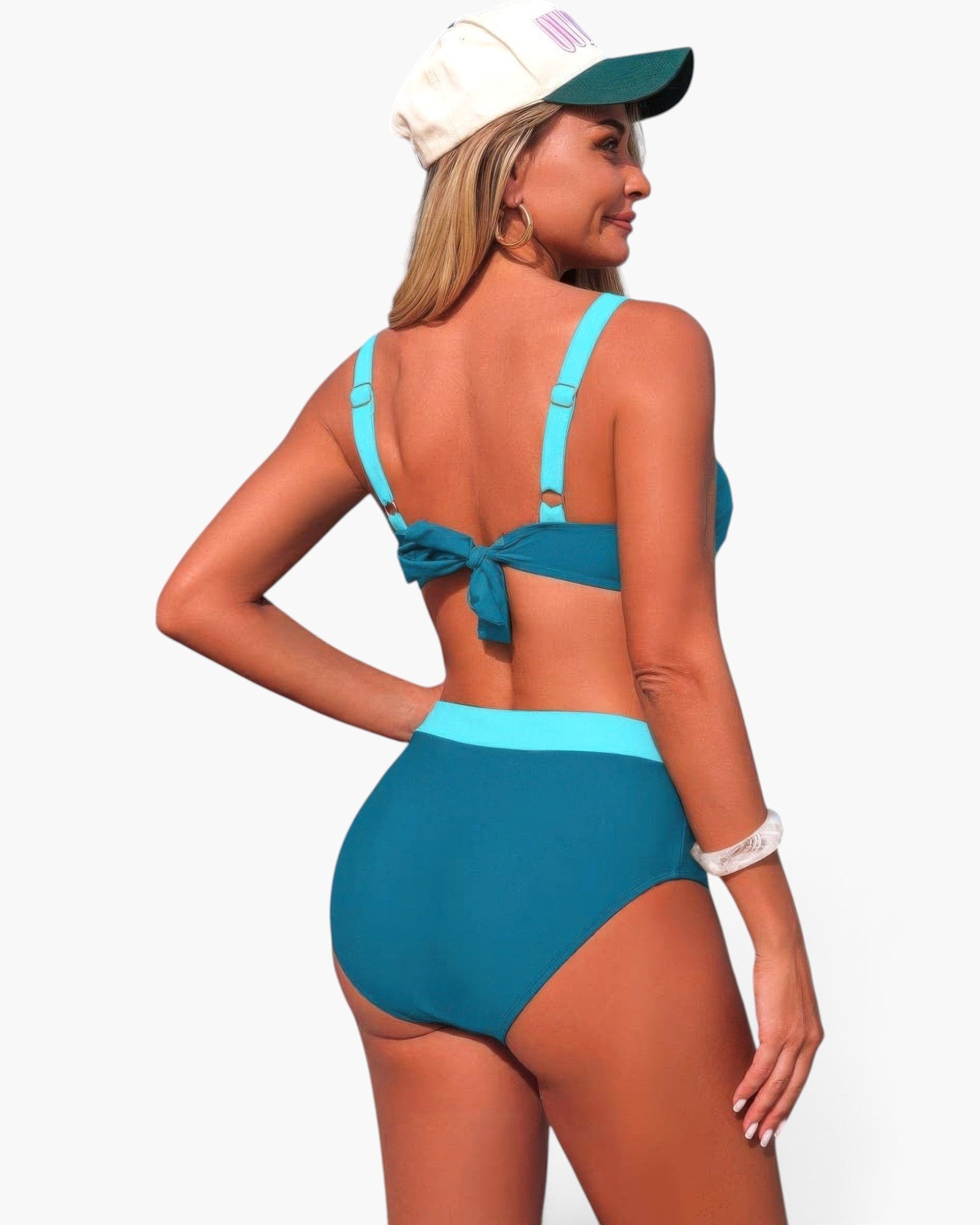 Beach Rose Co. two-piece colorblock bikini in teal and bright blue with a back knot detail worn by a woman in a cap.