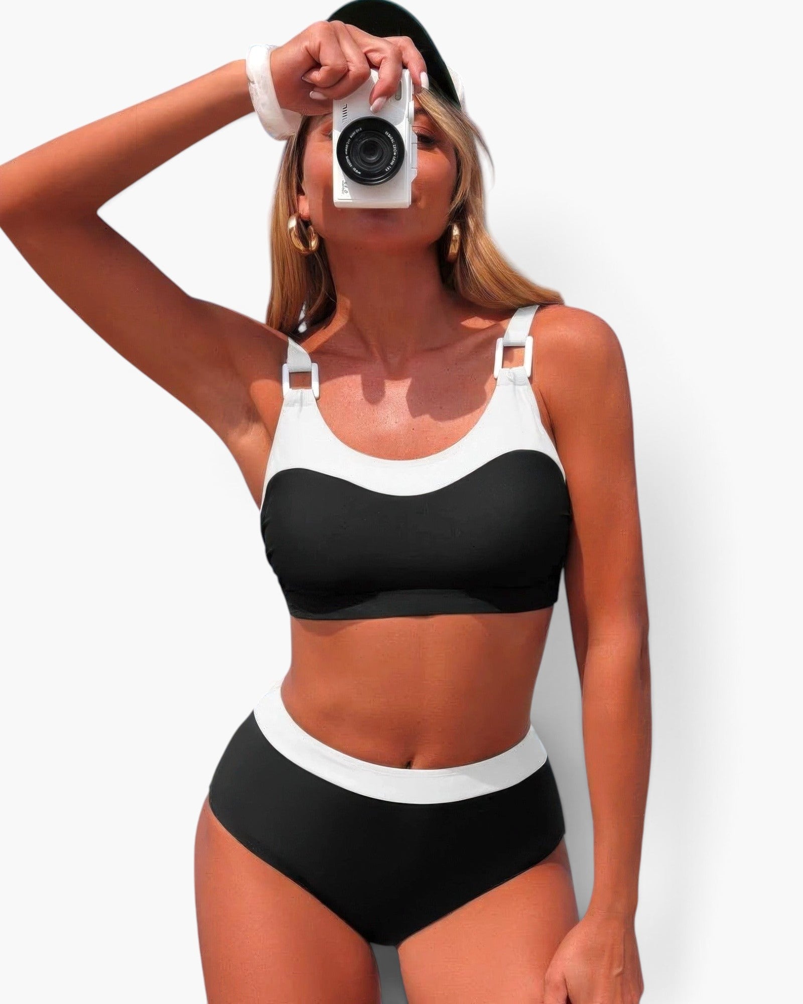 Beach Rose Co. two-piece colorblock bikini with a sleeveless top and high-waisted bottoms on a woman holding a camera.