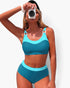 Beach Rose Co. two-piece colorblock bikini in teal and light blue with a sleeveless top and high-waisted bottoms.