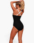 Beach Rose Co. one-piece colorblock swimsuit with white cross-back straps worn by a woman against a white background.